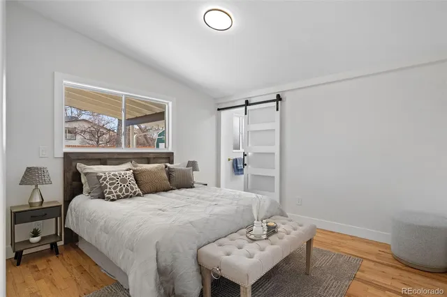 a bedroom with a bed and a table in it