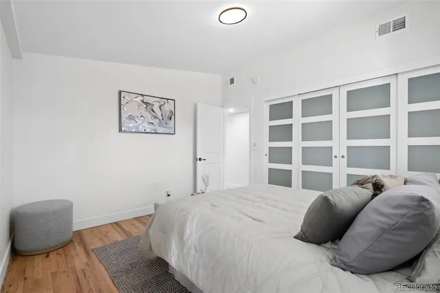 a bedroom with a bed and a chair