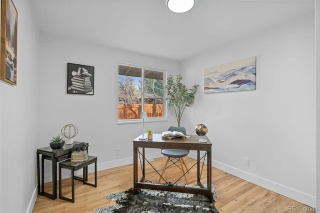 a workspace with furniture and window