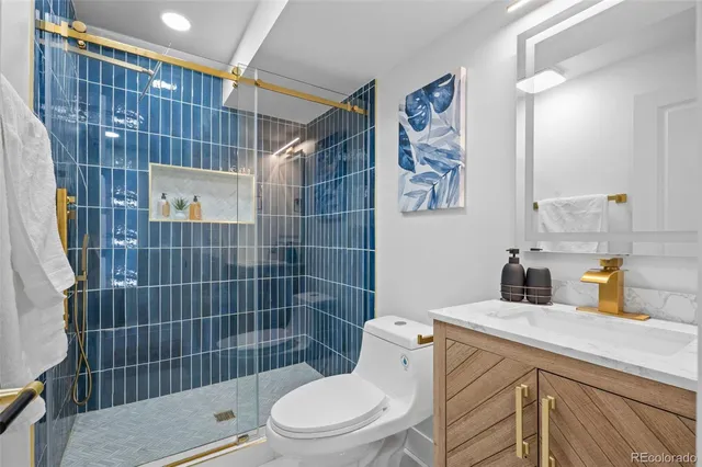 a bathroom with a toilet sink and shower