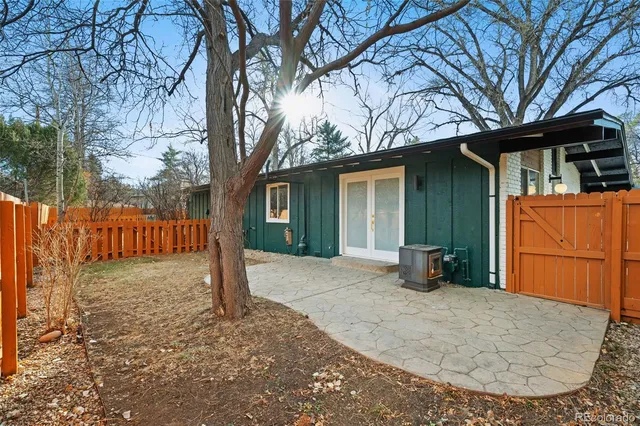 a view of a house with a snow in the yard