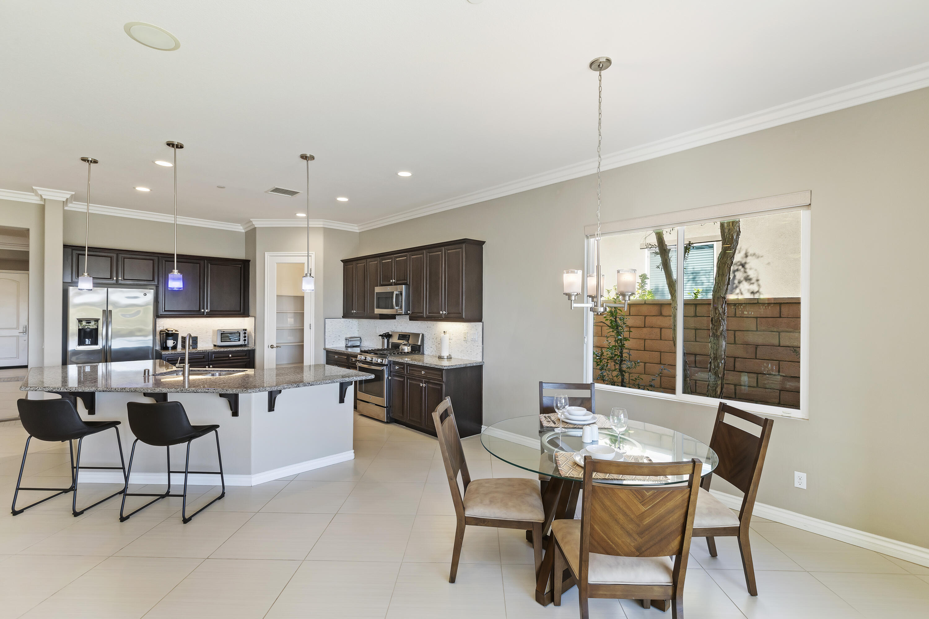 43020 Ascona Lane Indio, CA 92203 - Photo 14 of 33 a view of a dining room with furniture