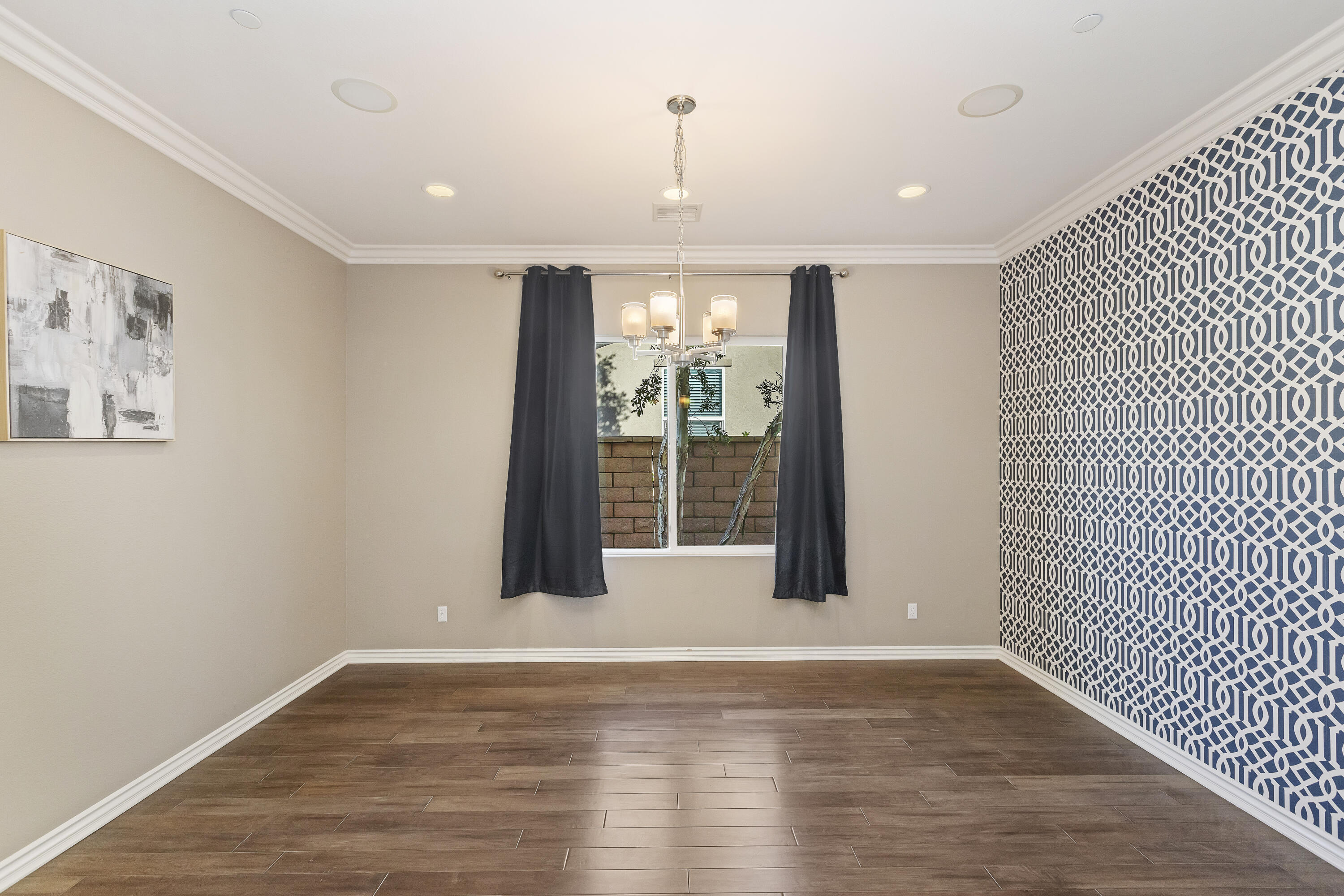 43020 Ascona Lane Indio, CA 92203 - Photo 15 of 33 a view of an empty room with wooden floor and a window