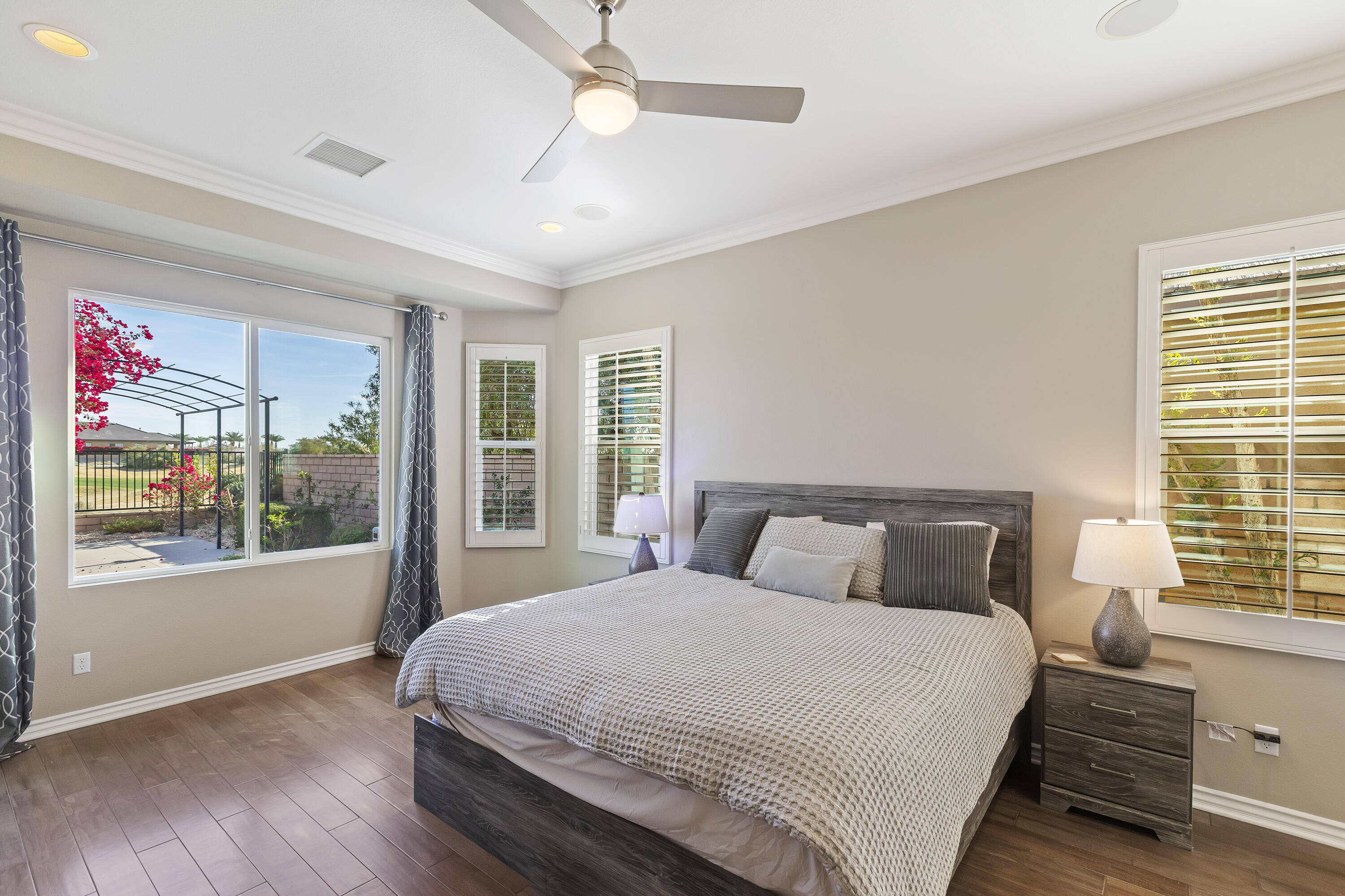 43020 Ascona Lane Indio, CA 92203 - Photo 18 of 33 a bedroom with a large bed and a window