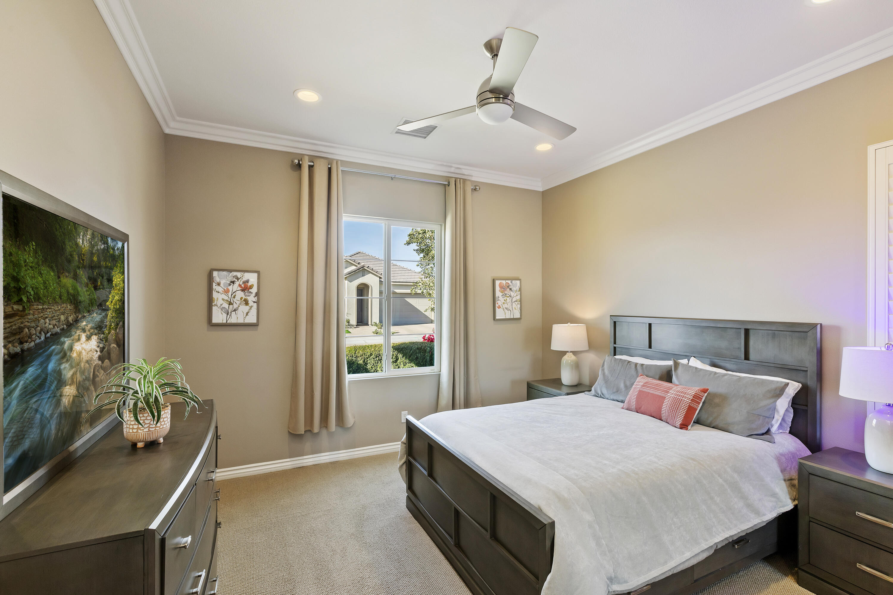 43020 Ascona Lane Indio, CA 92203 - Photo 22 of 33 a bedroom with a bed and a flat screen tv