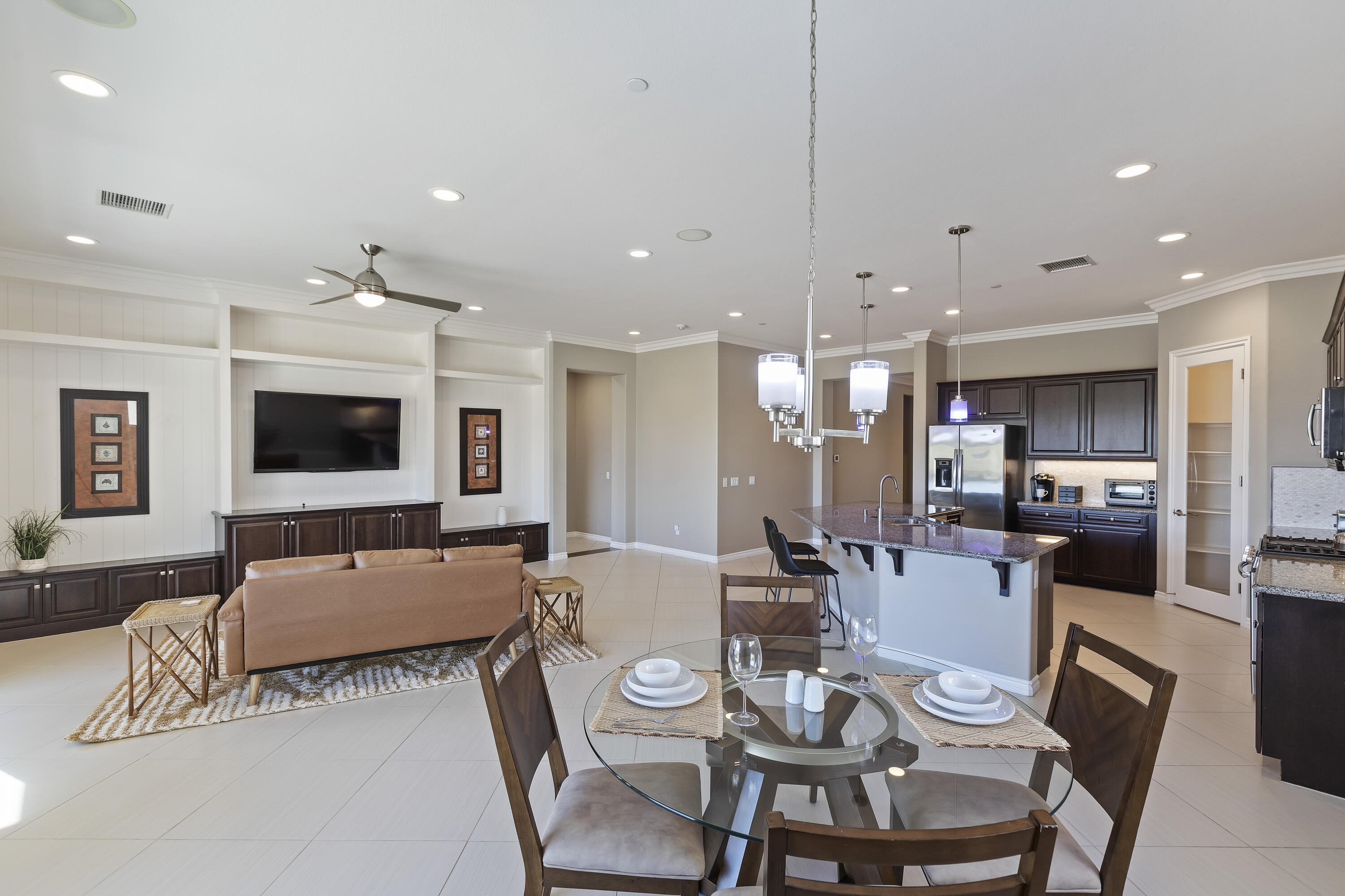 43020 Ascona Lane Indio, CA 92203 - Photo 5 of 33 a living room with furniture kitchen view and a flat screen tv