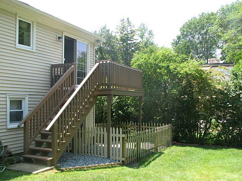 14 What Cheer Road Narragansett, RI 02882 - Photo 20 of 25 Exterior Back. DECK DIRECTLY OFF DINIGN AREA FOR EASY ENTERTAINING