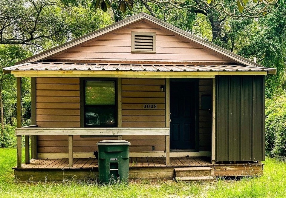 3005 Old Houston Road, Unit C Huntsville, TX 77340 - Photo 1 of 4 a front view of house with a yard