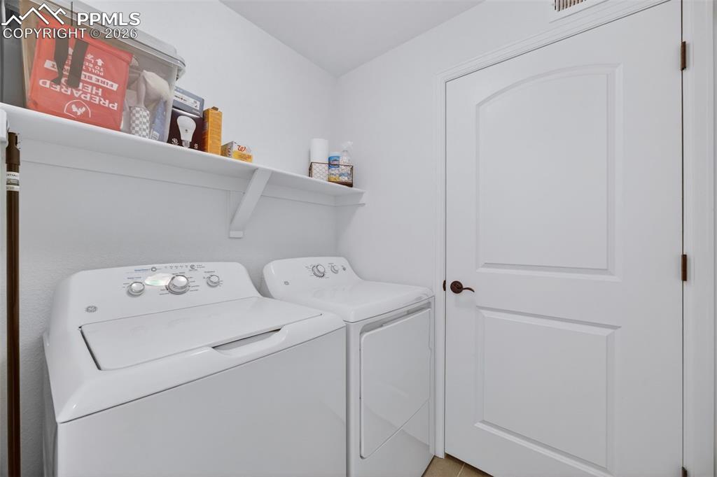 4658 Copeland Circle, Unit 103 Highlands Ranch, CO 80126 - Photo 21 of 37 a utility room with dryer and washer