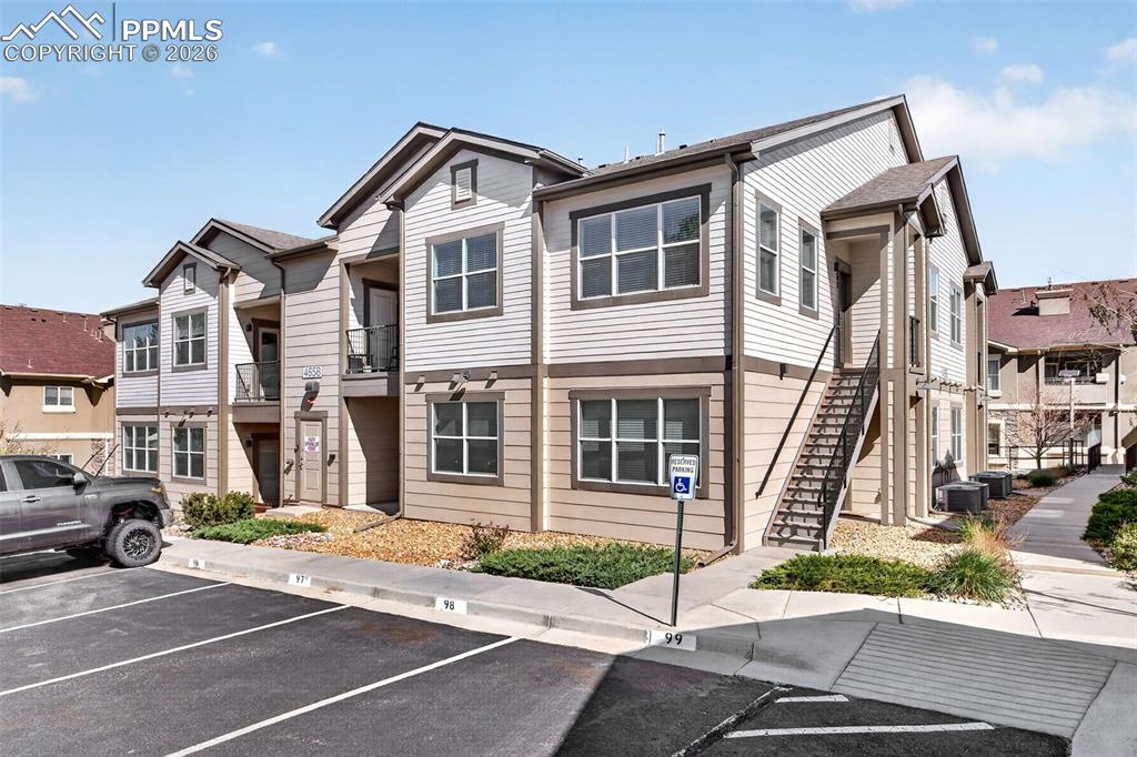 4658 Copeland Circle, Unit 103 Highlands Ranch, CO 80126 - Photo 3 of 37 a front view of a building with street view