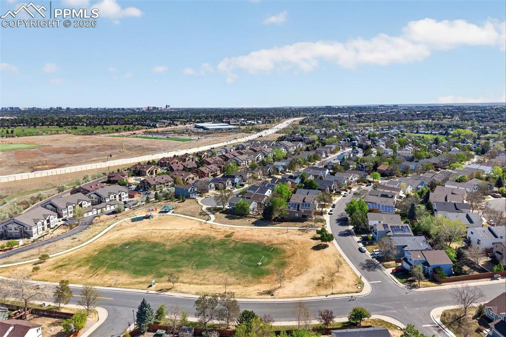 4658 Copeland Circle, Unit 103 Highlands Ranch, CO 80126 - Photo 32 of 37 an aerial view of residential building and lake