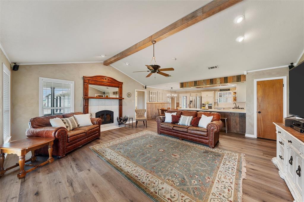 3057 Holy Road Abbott, TX 76621 - Photo 14 of 40 a living room with furniture a fireplace and a table