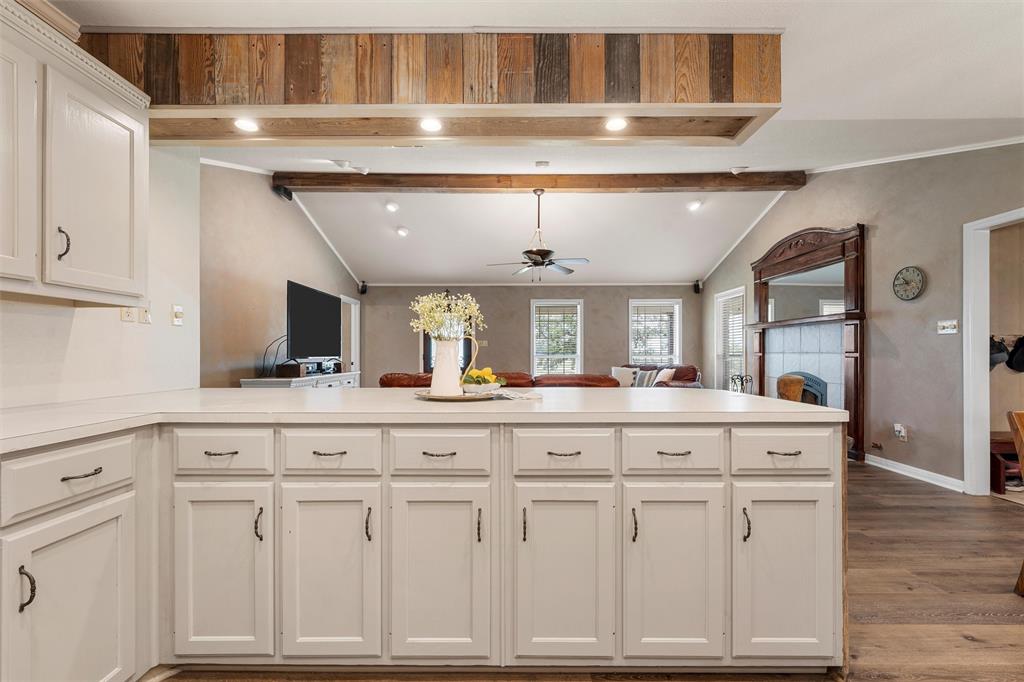3057 Holy Road Abbott, TX 76621 - Photo 18 of 40 a kitchen with granite countertop a sink and cabinets