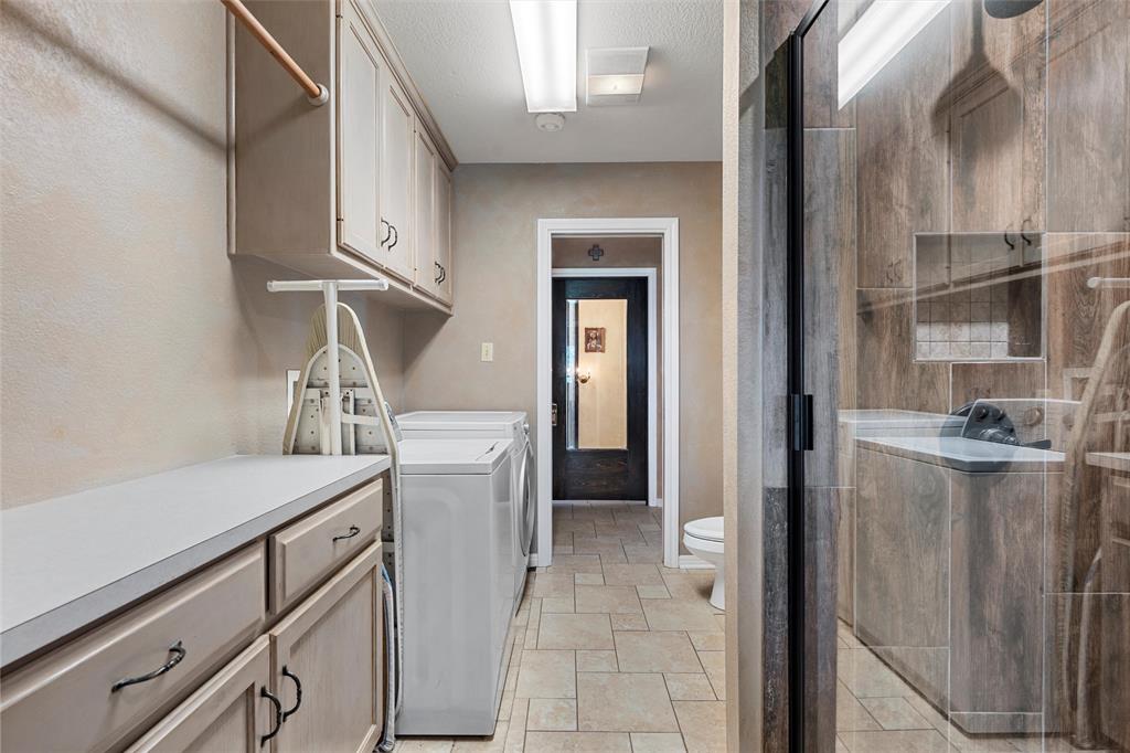 3057 Holy Road Abbott, TX 76621 - Photo 22 of 40 a kitchen with a refrigerator and cabinets