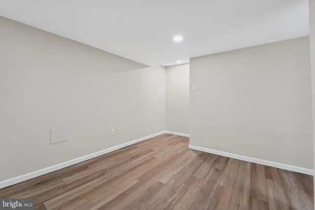 a view of room with wooden floor