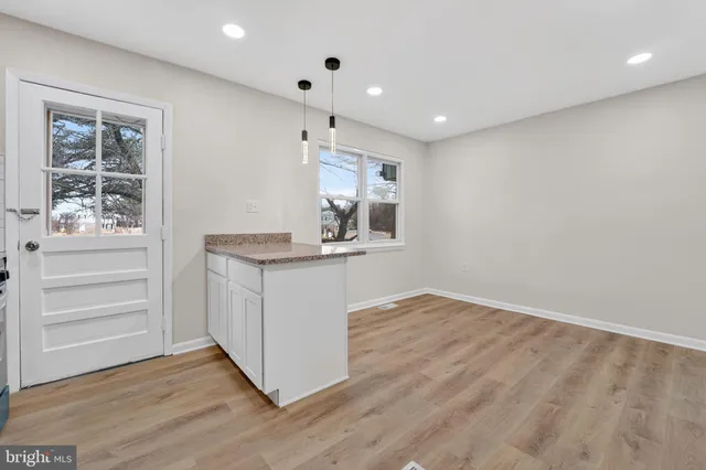 a bathroom with a sink vanity and a mirror