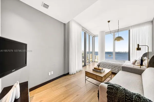 a view of balcony with wooden floor