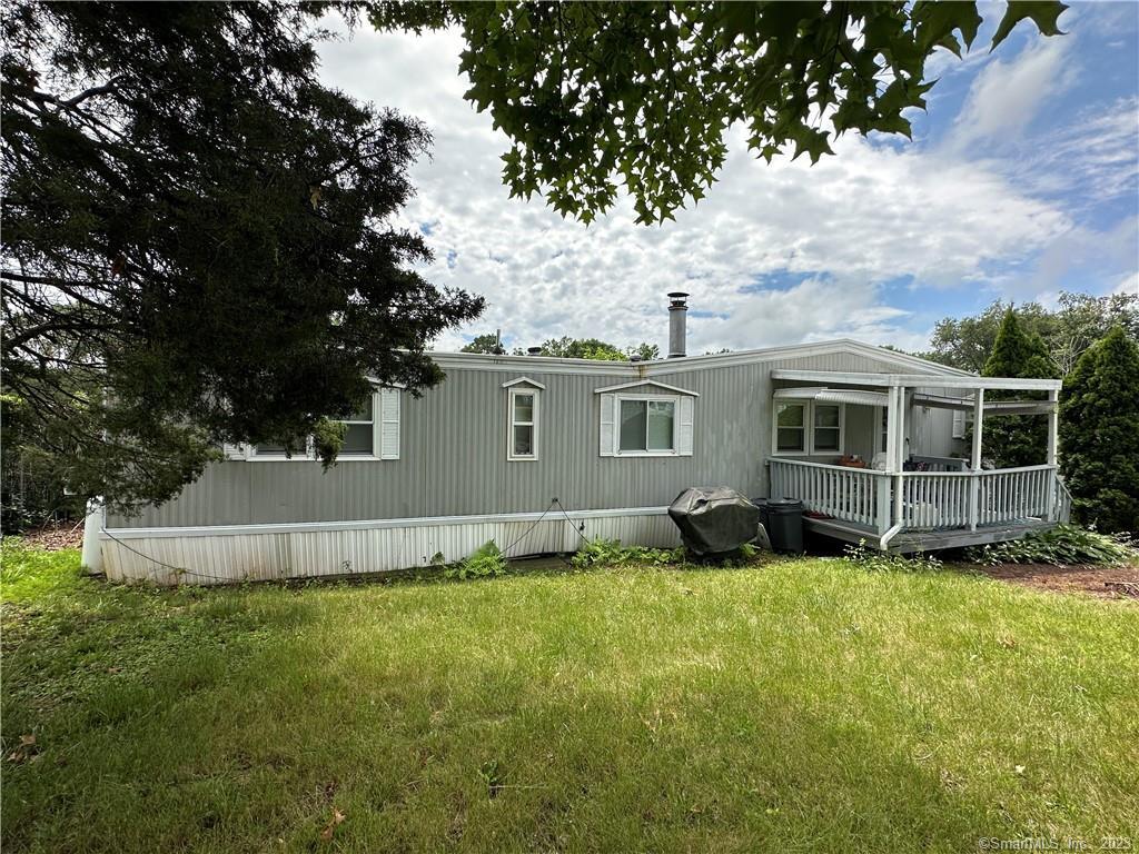292 Deming Road, Unit 1 Berlin, CT 06037 - Photo 1 of 1 a view of a house with a yard