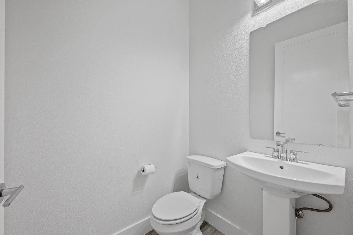 4705 Louis Avenue, Unit B Austin, TX 78721 - Photo 12 of 39 Bathroom featuring baseboards and toilet