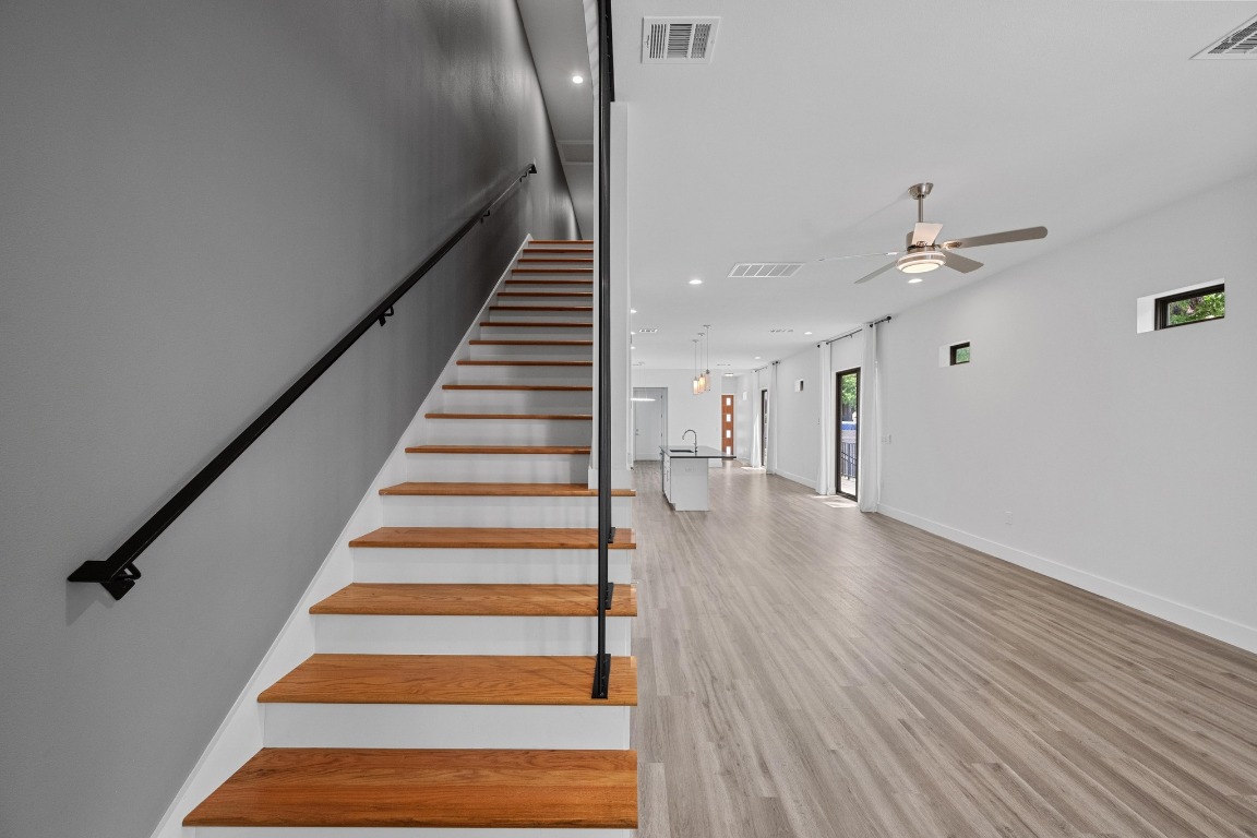 4705 Louis Avenue, Unit B Austin, TX 78721 - Photo 14 of 39 Stairs featuring ceiling fan, baseboards, and visible vents