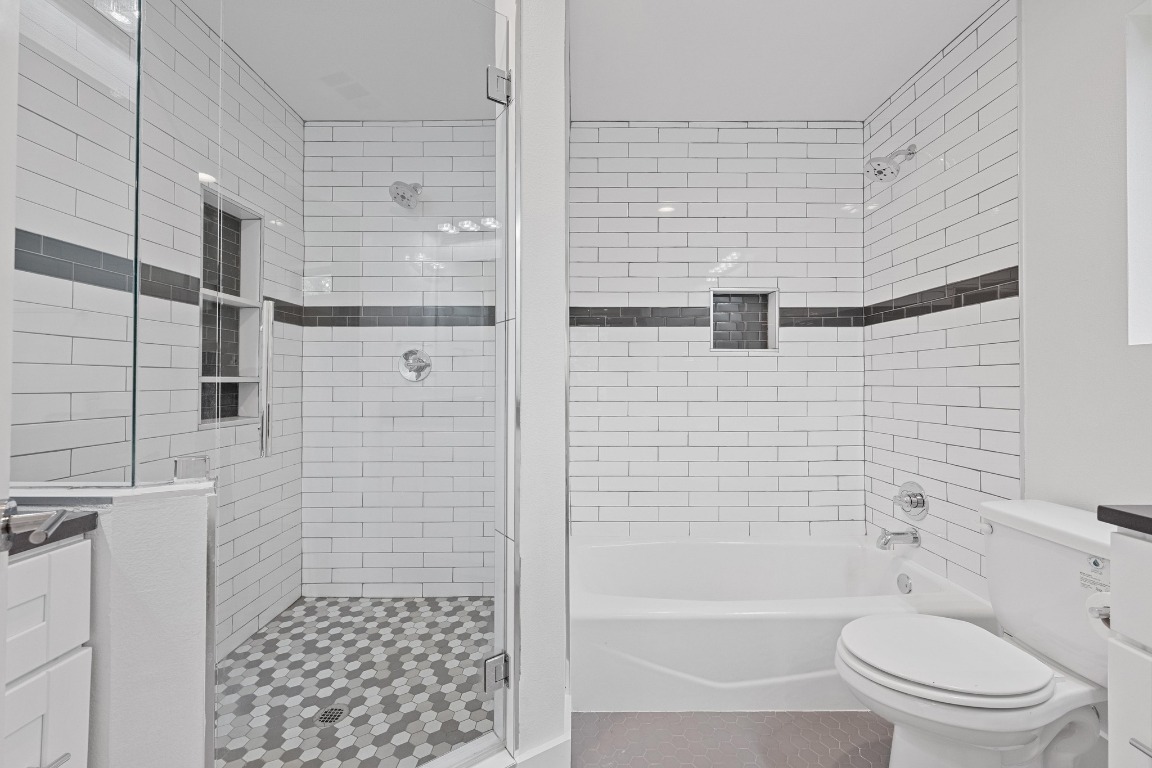 4705 Louis Avenue, Unit B Austin, TX 78721 - Photo 18 of 39 Full bathroom with toilet, tile patterned floors, and tiled shower / bath combo