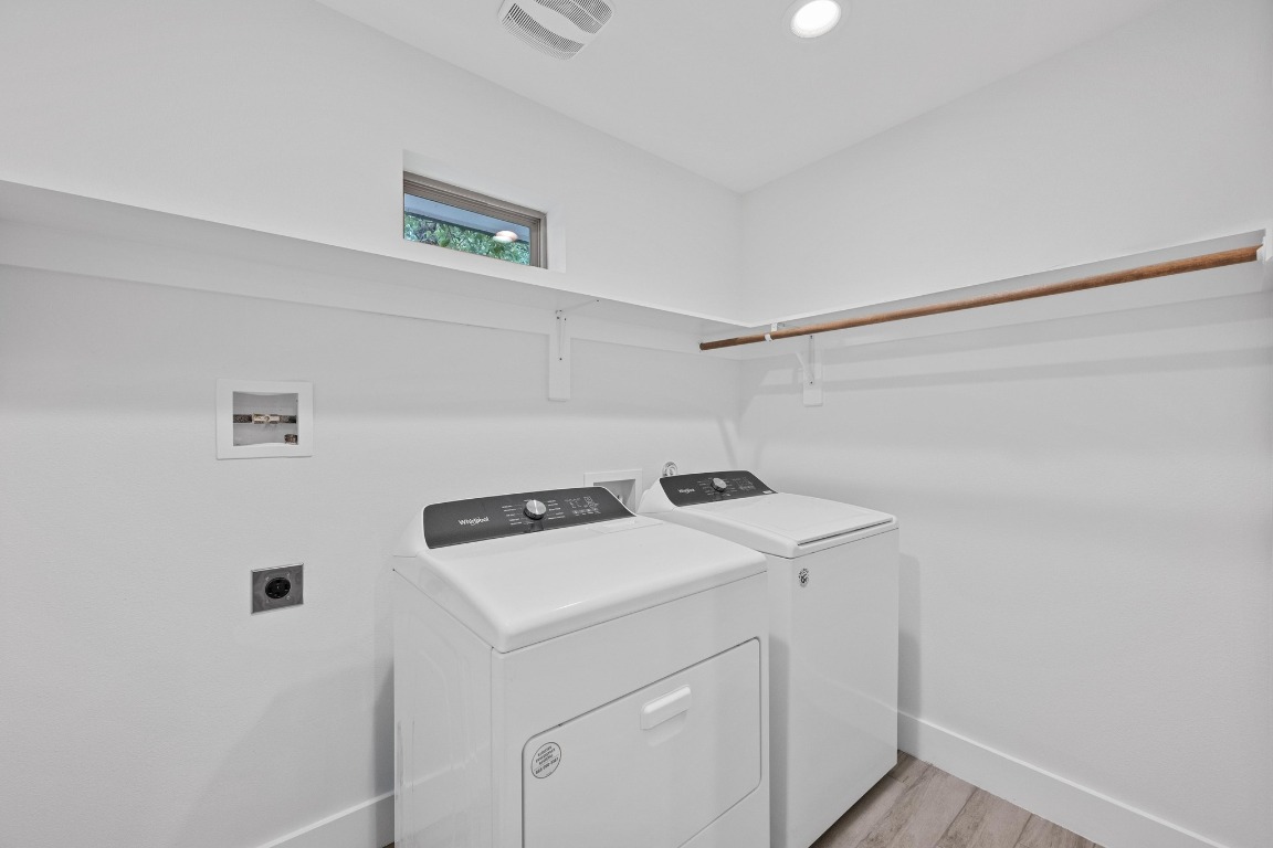 4705 Louis Avenue, Unit B Austin, TX 78721 - Photo 27 of 39 Laundry room featuring hookup for an electric dryer, hookup for a washing machine, baseboards, and laundry area