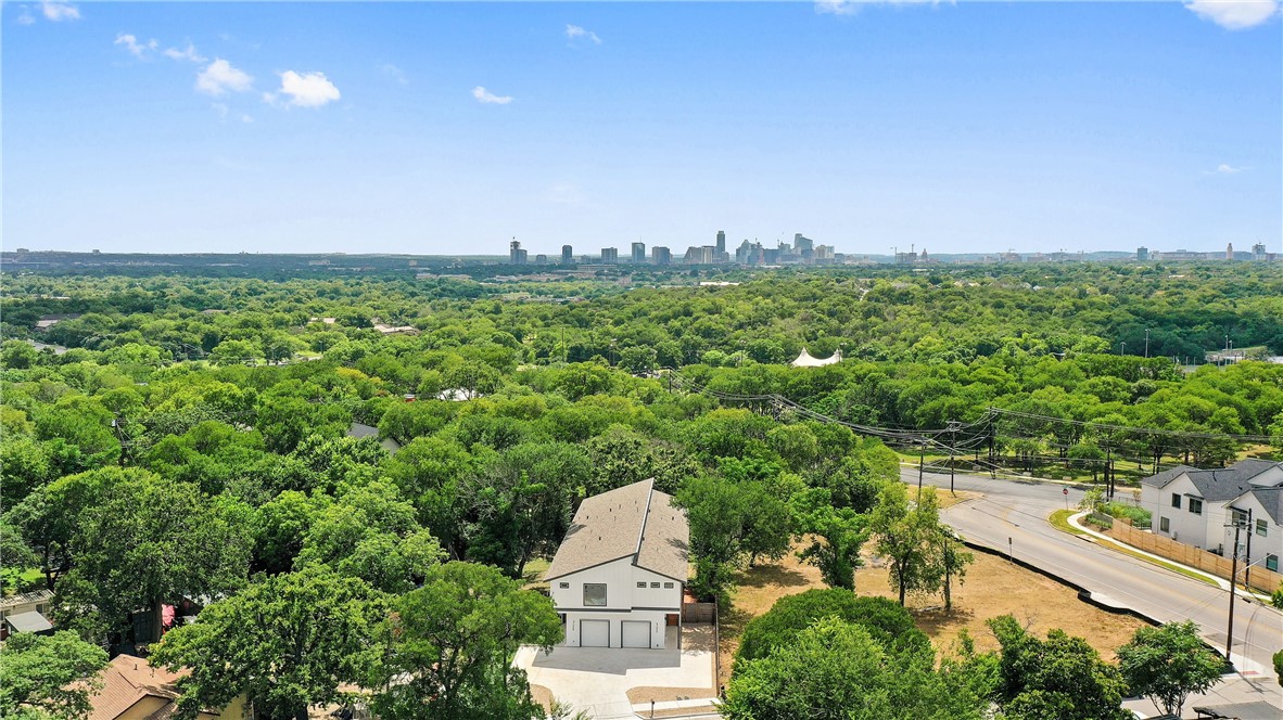4705 Louis Avenue, Unit B Austin, TX 78721 - Photo 36 of 39 Drone / aerial view with a forest view