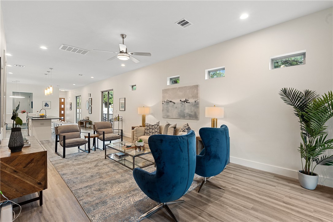 4705 Louis Avenue, Unit B Austin, TX 78721 - Photo 6 of 39 Living room with recessed lighting, wood finished floors, visible vents, baseboards, and ceiling fan