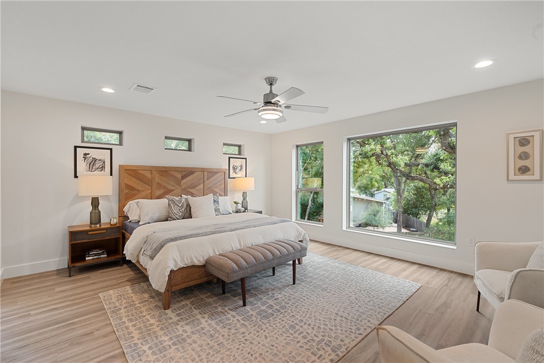 4705 Louis Avenue, Unit B Austin, TX 78721 - Photo 8 of 39 Bedroom featuring light wood finished floors, baseboards, recessed lighting, and ceiling fan