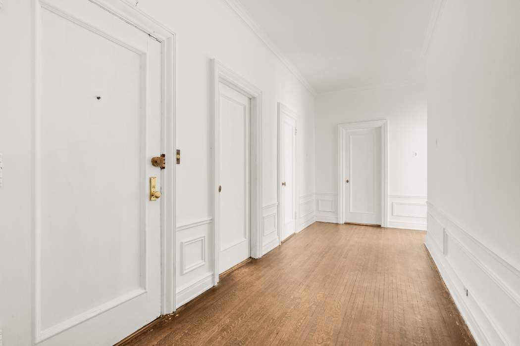 150 East 72nd Street, Unit 6S Manhattan, NY 10021 - Photo 21 of 23 a view of a hallway with wooden floor