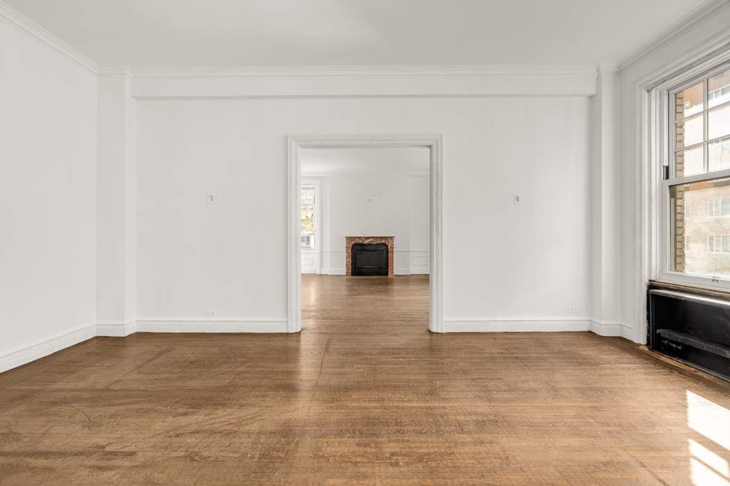 150 East 72nd Street, Unit 6S Manhattan, NY 10021 - Photo 8 of 23 a view of livingroom with hardwood floor and window