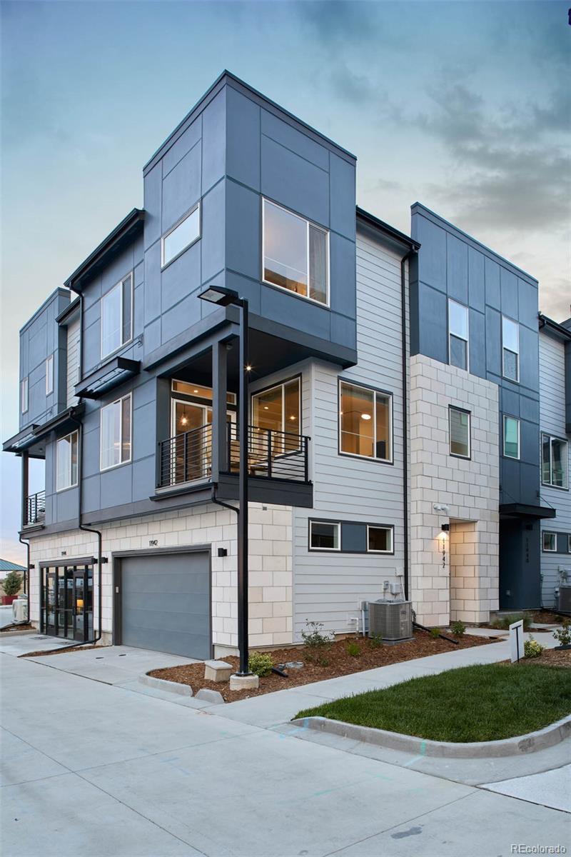 11942 Soprano Trail Lone Tree, CO 80134 - Photo 4 of 11 a view of a building with many windows