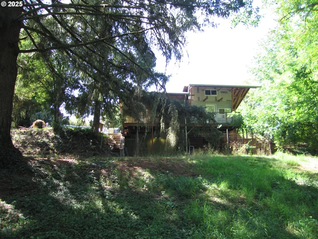 a backyard of a house with lots of green space