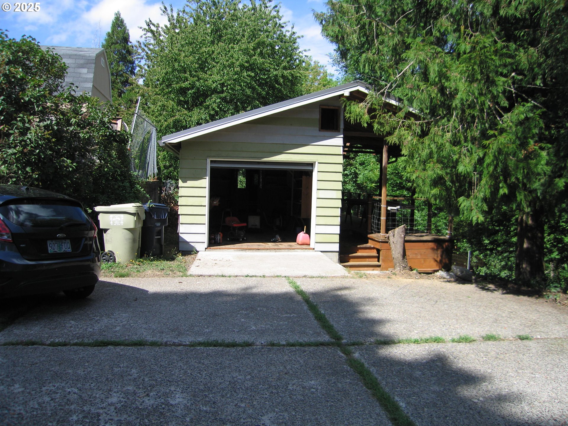 18795 Southwest Vista Street Beaverton, OR 97003 - Photo 30 of 31 a front view of a house with a yard and garage