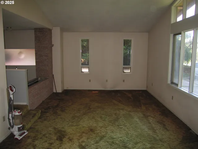 an empty room with windows