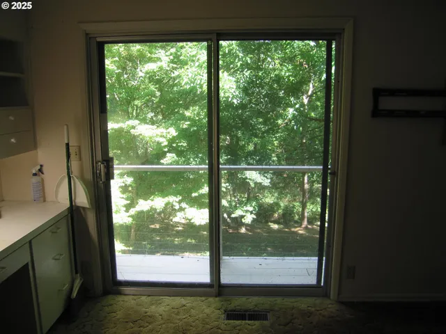 a view of a room with a large window