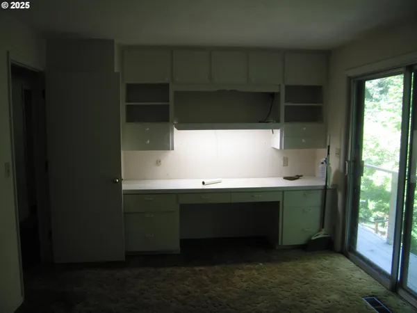 a room with a window and a sink