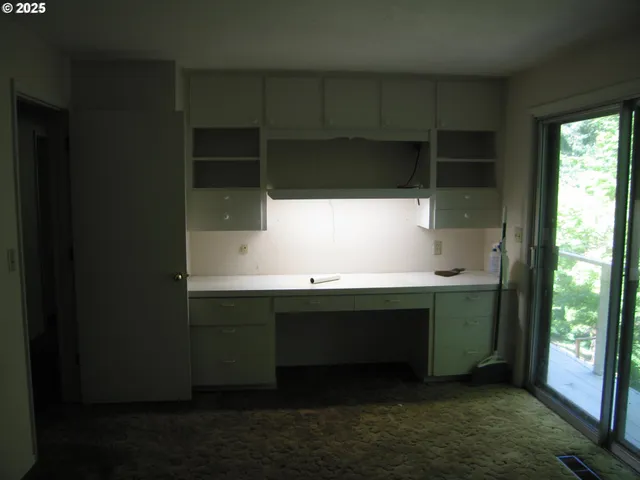 a room with a window and a sink