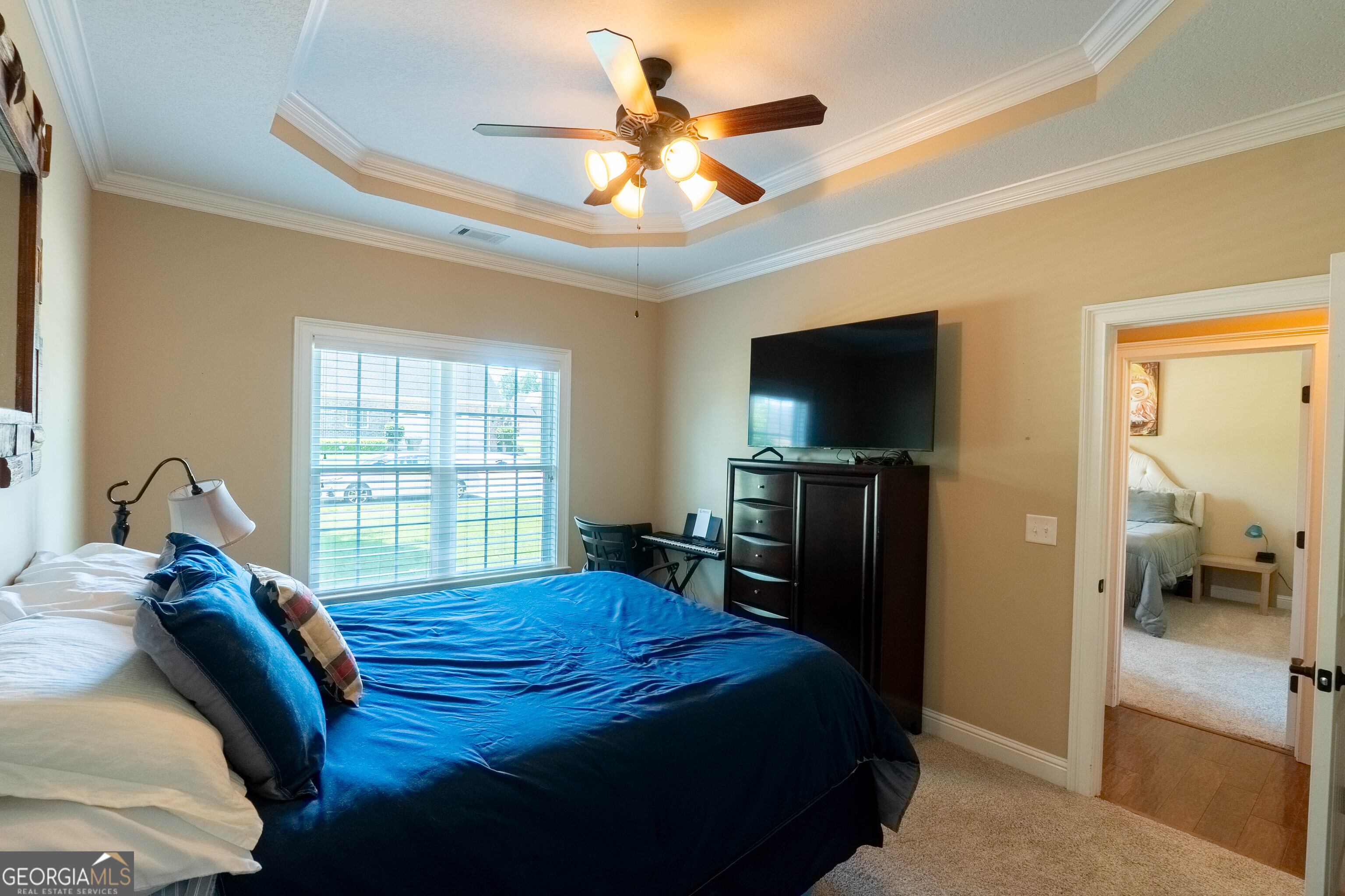 501 Old Bridge Road Warner Robins, GA 31088 - Photo 29 of 54 a bedroom with a bed and a flat screen tv