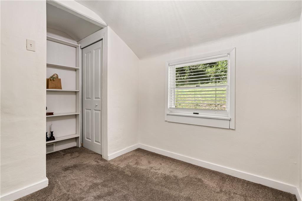 431 Filmore Road Pittsburgh, PA 15221 - Photo 17 of 34 Bedroom #3 with built in shelves adjoining a closet.