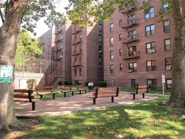 a park view with a bench in a yard
