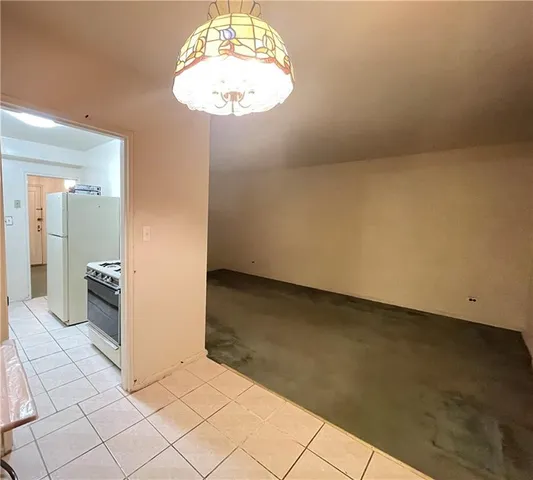 a kitchen with a stove and a refrigerator