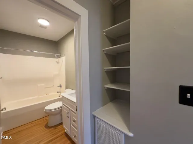 a bathroom with a toilet a sink and a bathtub