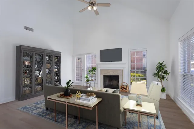 a view of an empty room with a fireplace and a window