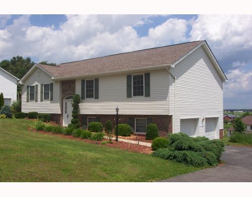 599 Slippery Rock Road Slippery Rock, PA 16057 - Photo 2 of 13 Exterior Front. separate garage doors for his and hers garage areas - note Applewood Meadows in the background