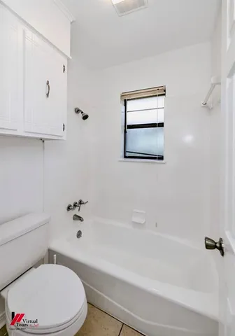 a bathroom with a sink a toilet and a bathtub