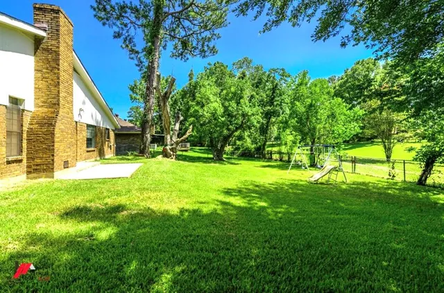 a view of swimming pool with a garden