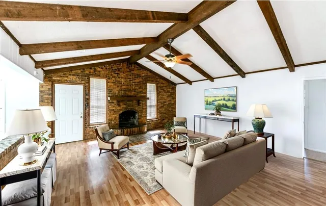 a living room with furniture and a fireplace