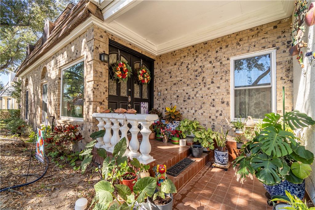 front view of a house with a potted plant