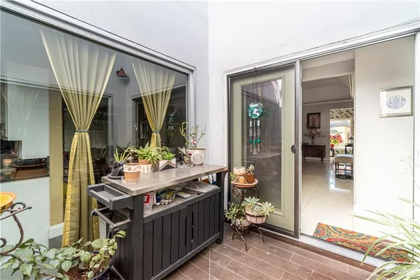 a view of living room kitchen and entryway